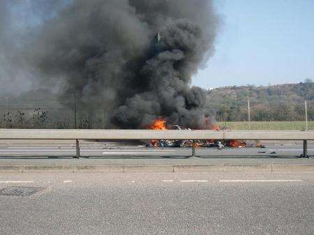 Firefighters tackle a vehicle fire on the A289, Wainscott