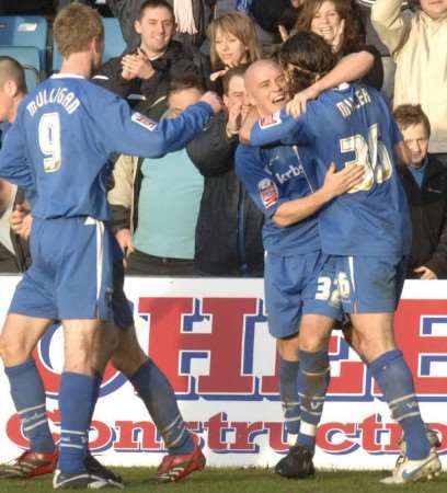 Gillingham players celebrate Adam Miller's goal