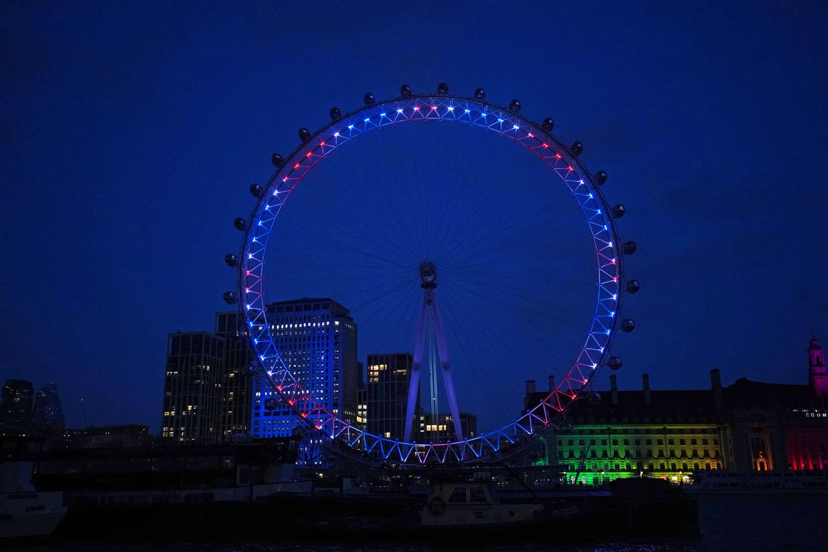 The London Eye is lit up with the colours of the Union flag following the death of Captain Sir Tom Moore (Aaron Chown/PA)