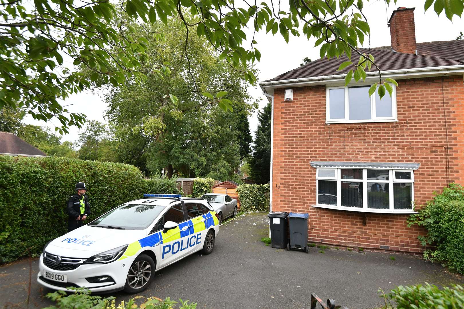 Police at McLeod’s home in Birmingham (Jacob King/PA)