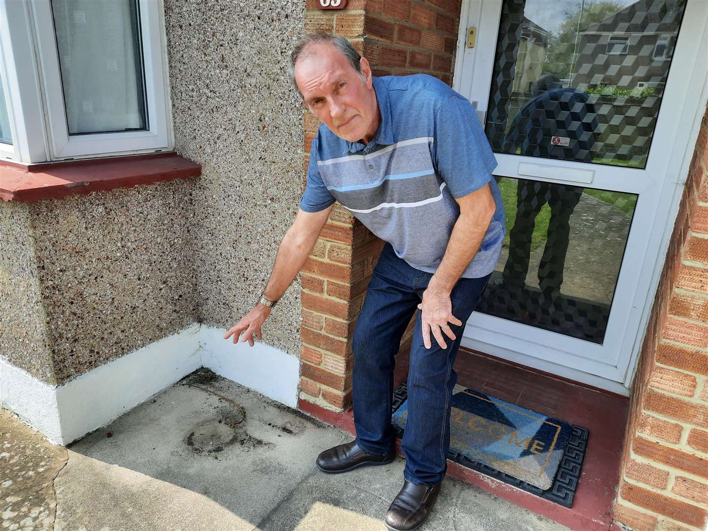 Allan Clifford stood next to where his mother's ashes once lay outside his Herne Bay home