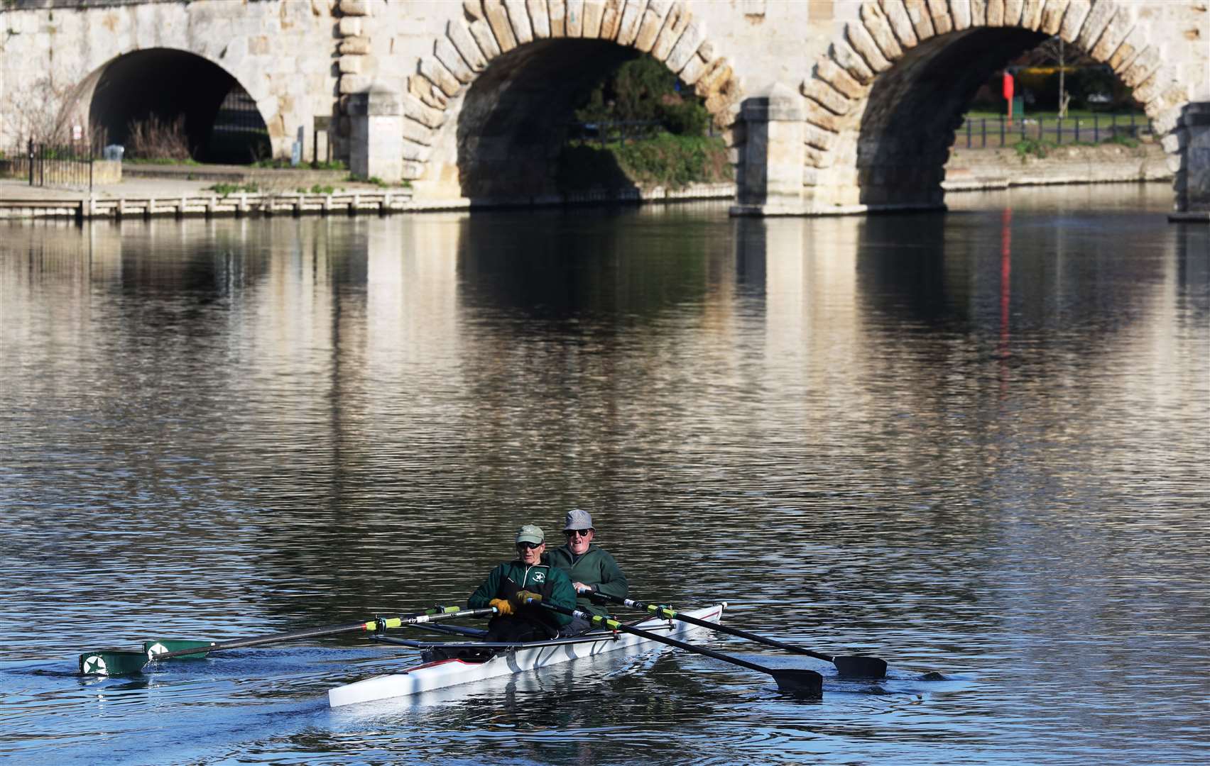 A pair of rowers travel along the River Thames at Maidenhead, Berkshire (Jonathan Brady/PA)