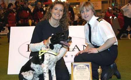 TOP DOG: Detector Dog Chase at his retirement presentation with BBC presenter Shauna Lowry and his handler, Helen.
