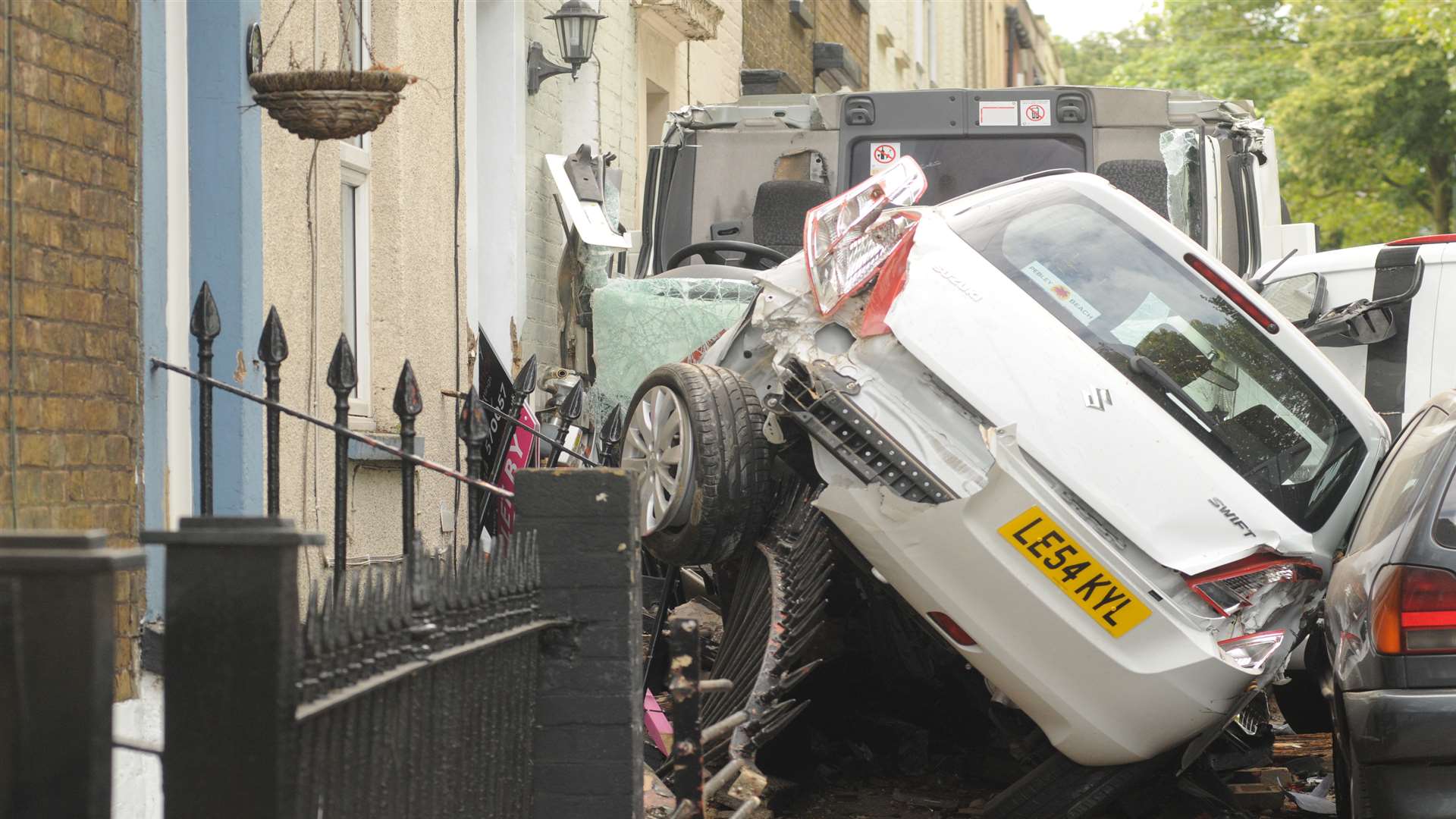 Cars were squashed up against homes during the collision