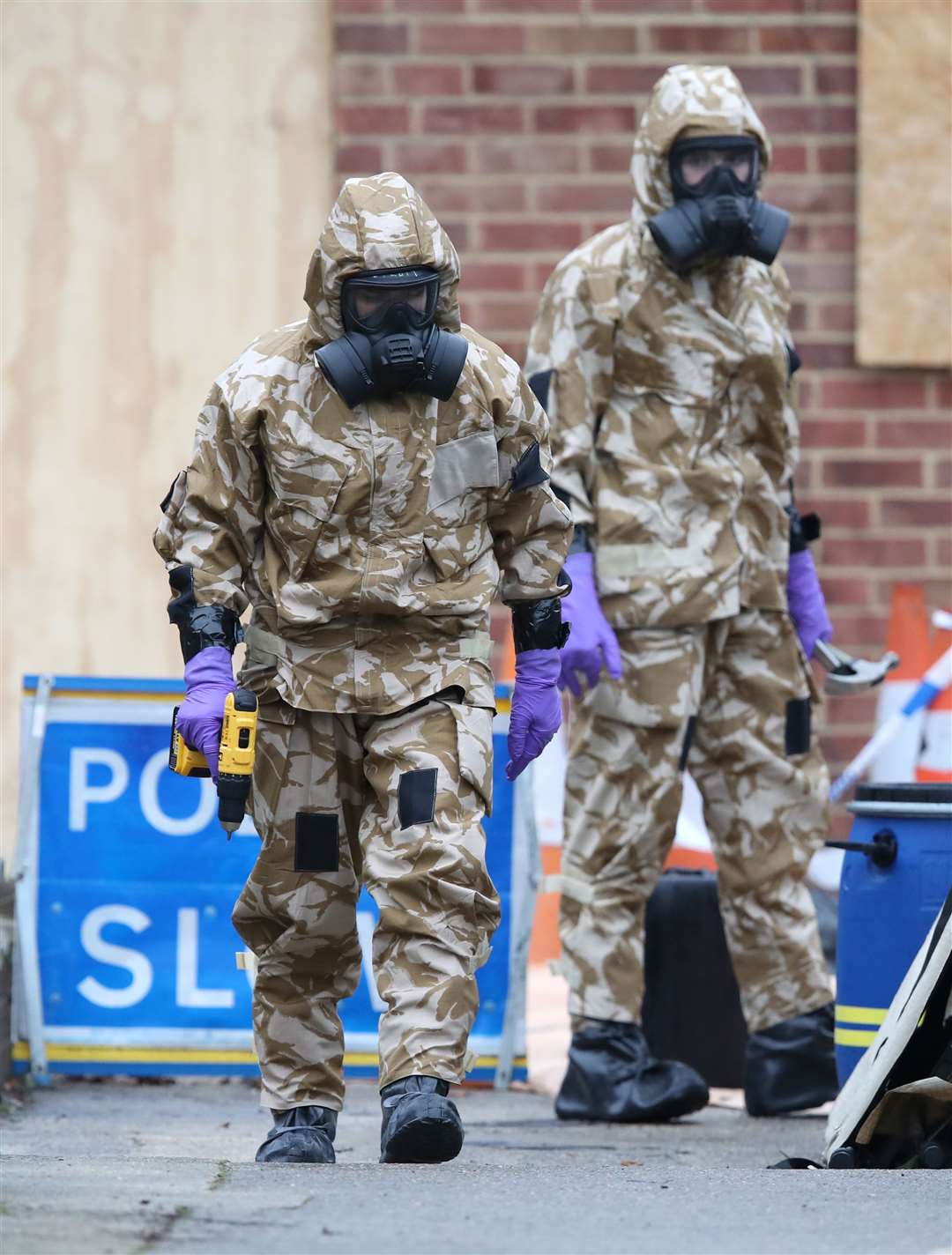 Members of the military wear protective clothing while investigating the home of Sergei Skripal following the poisonings (Andrew Matthews/PA)