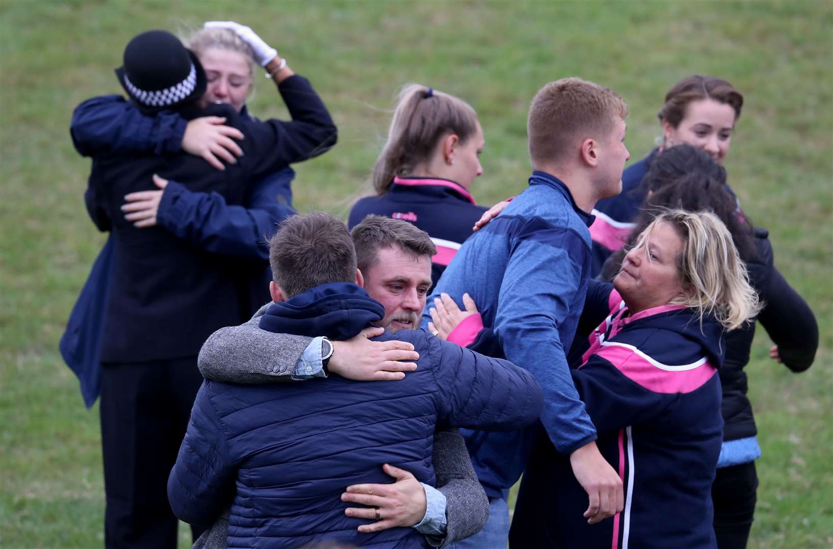 Players and club officials following a minute’s silence at East Grinstead Rugby Club (Gareth Fuller/PA)