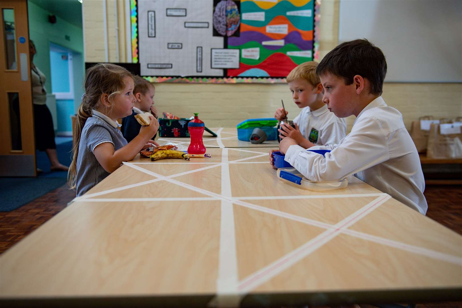 Children eat lunch (Jacob King/PA)