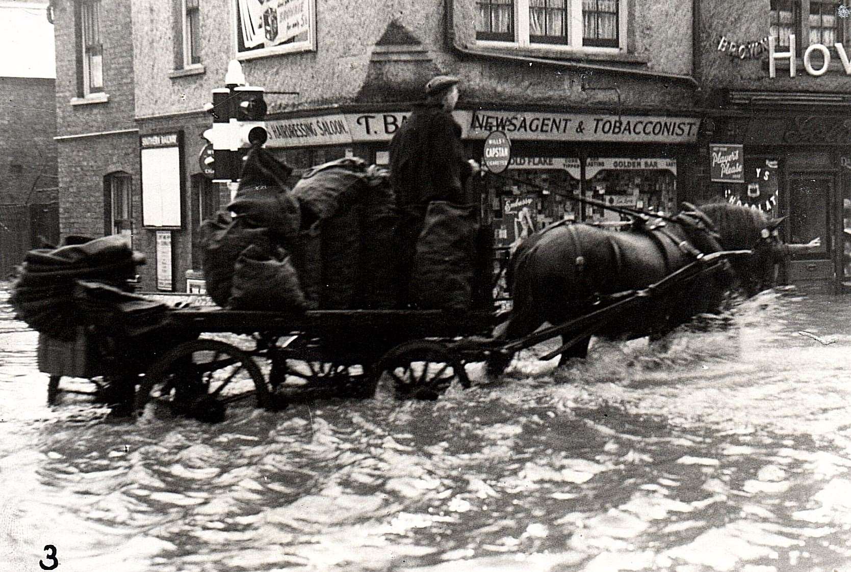 A horse-drawn cart makes its way through flood waters in Folkestone during floods in 1939. Picture: Alan Taylor