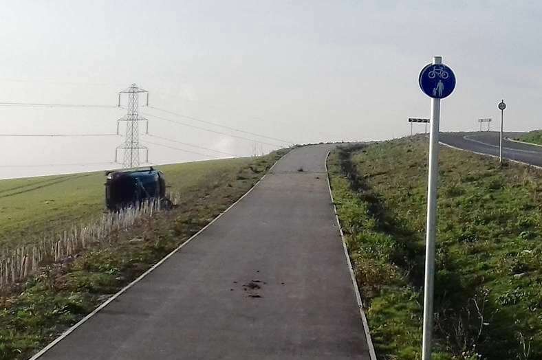 The car rolled onto its side, near Burham