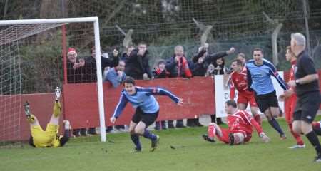 Sittingbourne's Tom Loynes scores against Hythe