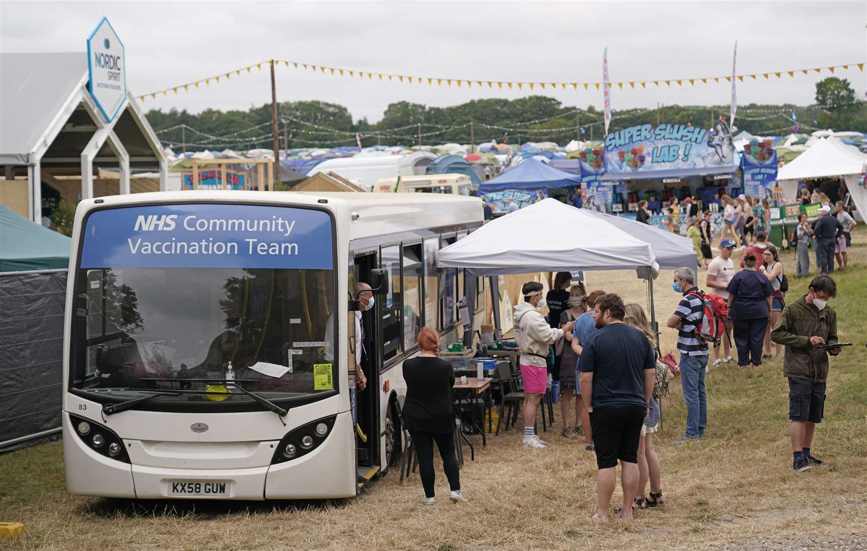 The vaccination bus has been set up inside the festival site (Jacob King/PA)