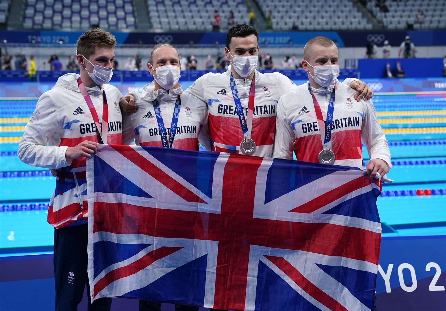 Great Britain’s (left-right) Duncan Scott, Luke Greenbank, James Guy and Adam Peaty after winning the silver medal in the men’s 4x100m medley relay (Joe Giddens/PA)