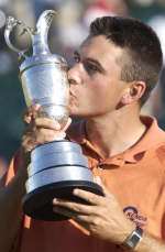 Champion Ben Curtis kisses the Claret Jug