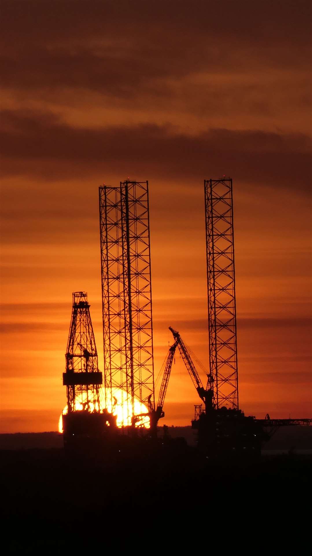 Sun sets behind the Prospector 1 oil-drilling rig now moored at Sheerness Docks on the Isle of Sheppey. Picture: Barry Hollis