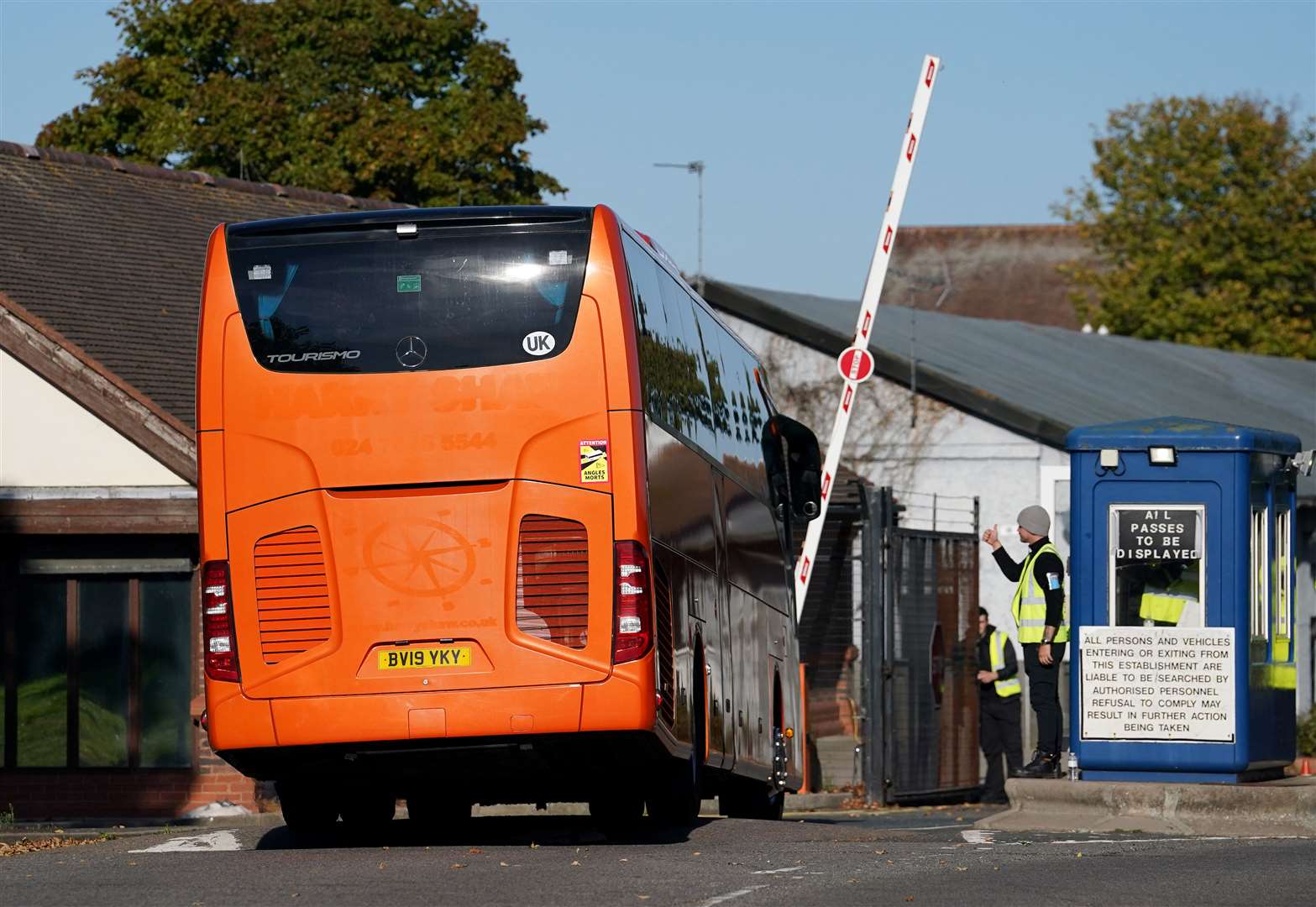 A bus carrying a group of people thought to be migrants arriving at the Manston centre (Gareth Fuller/PA)