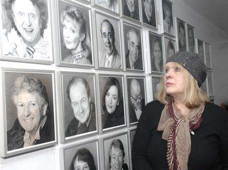 Theatre worker Jill Robin pauses to view pictures of the stars at the Marlowe.