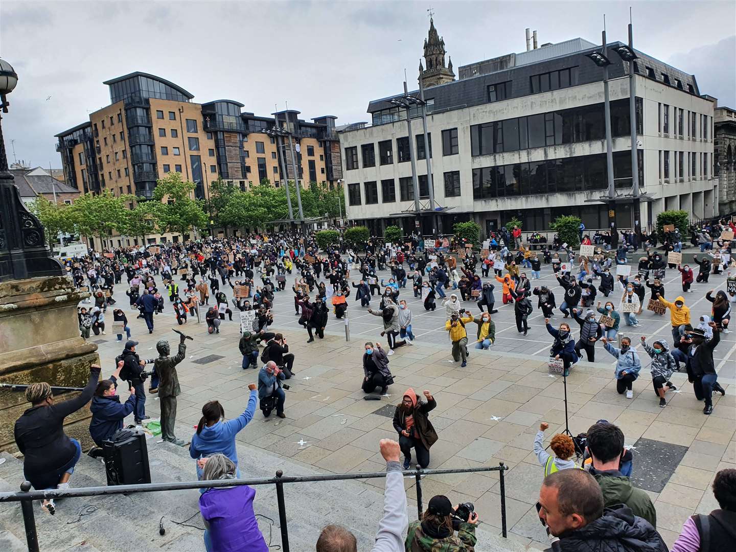 People take part in a Black Lives Matter protest rally in Custom House Square, Belfast, in memory of George Floyd (Rebecca Black/PA)