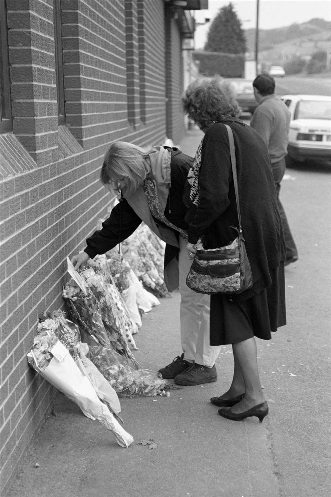 Flowers are laid at the scene of the Greysteel massacre (PA)