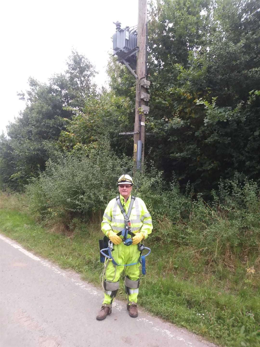 Age-defying Mr Lewry climbs high poles at 71.. Picture courtesy of UK Power Networks