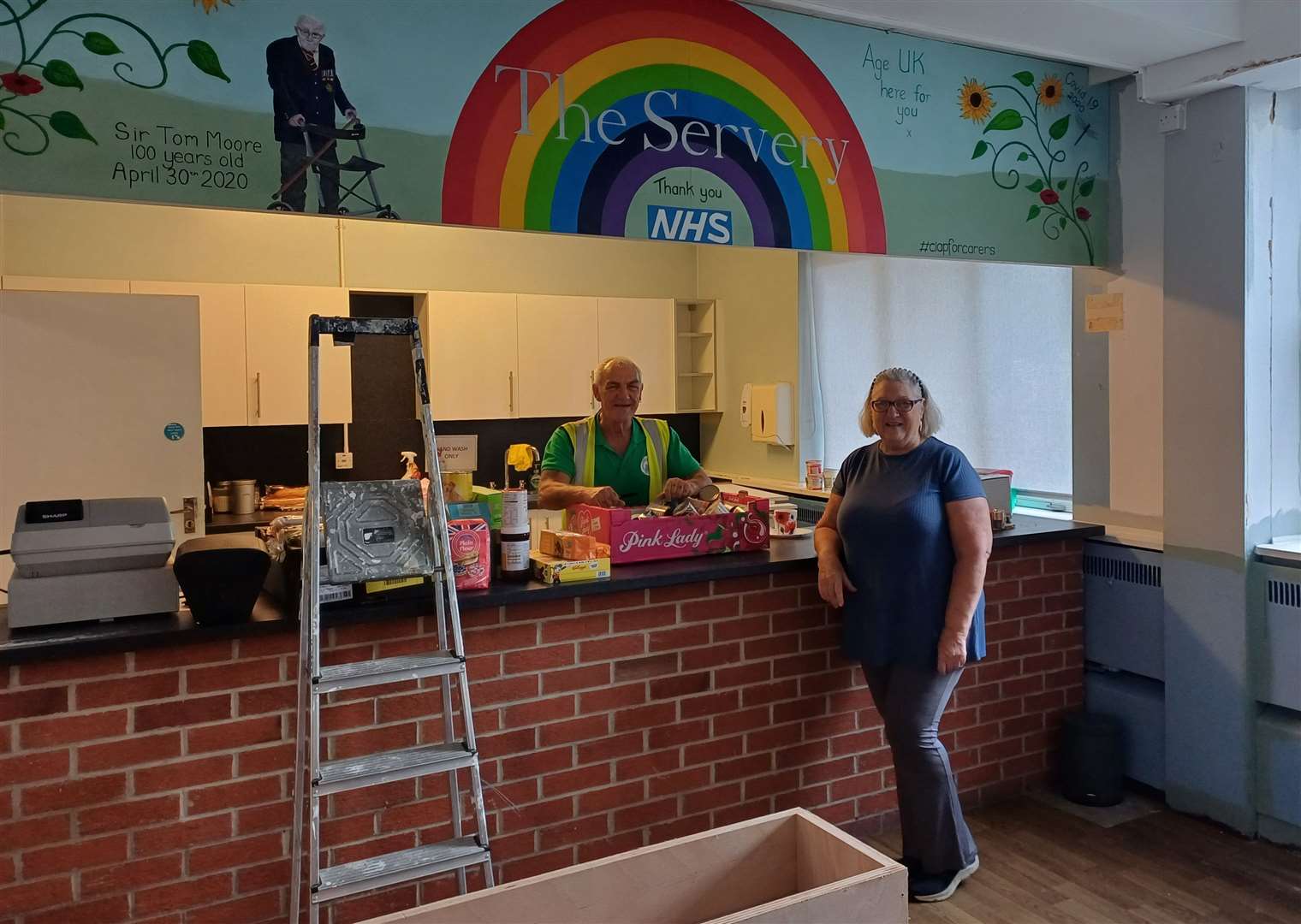 Trevor Thurlow and Elaine Allen by the serving hatch for the new cafe