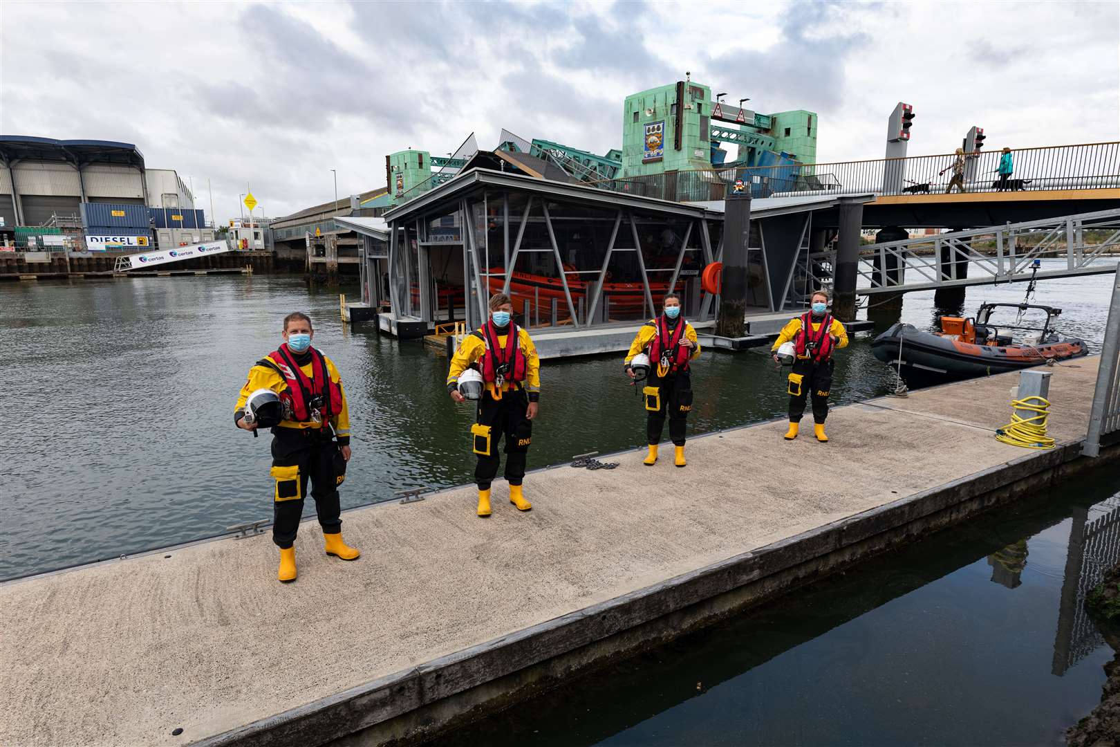 Poole volunteer lifeboat crew members outside the boathouse (Nathan Williams/RNLI/)