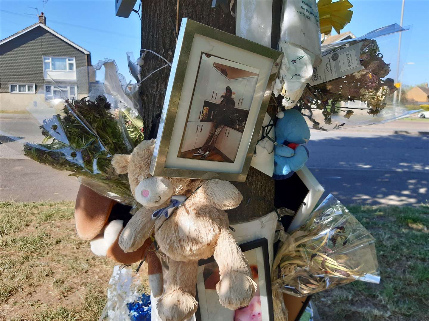 Flowers and cards laid at the scene off Brookfield Road