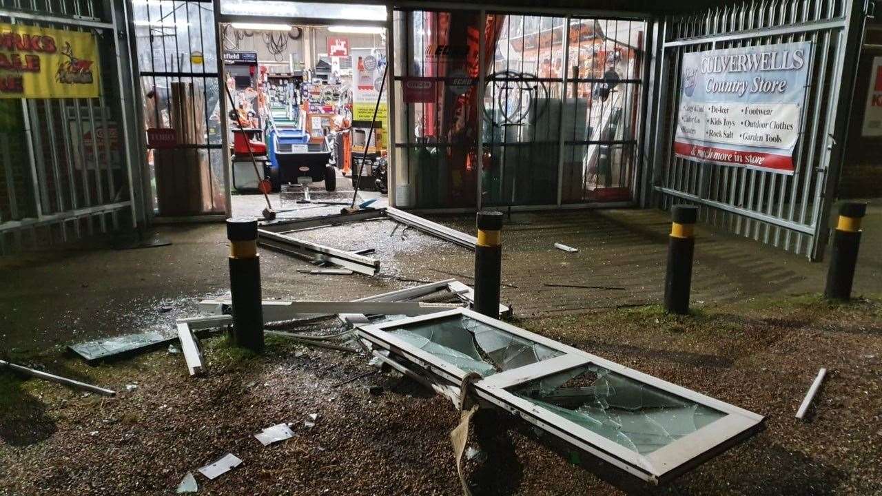 Doors lie smashed on the ground after being towed out by a 4x4