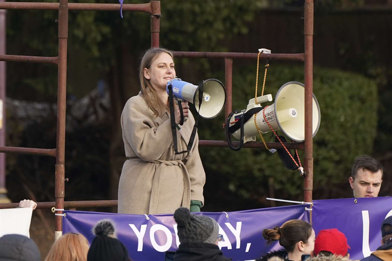 Laura Towler on stage during a protest by nationalist group Patriotic Alternative in Tower Gardens in Skegness, Lincolnshire near to the County Hotel used to house asylum seekers (PA)