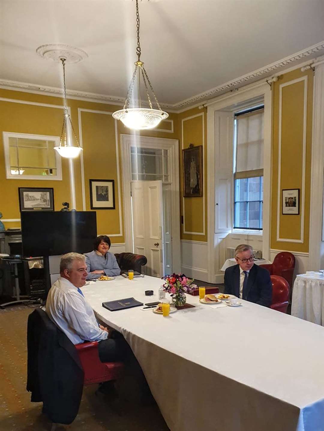 First Minister Arlene Foster, Michael Gove, and Northern Ireland Secretary Brandon Lewis during a breakfast meeting in Hillsborough Castle (DUP/PA)