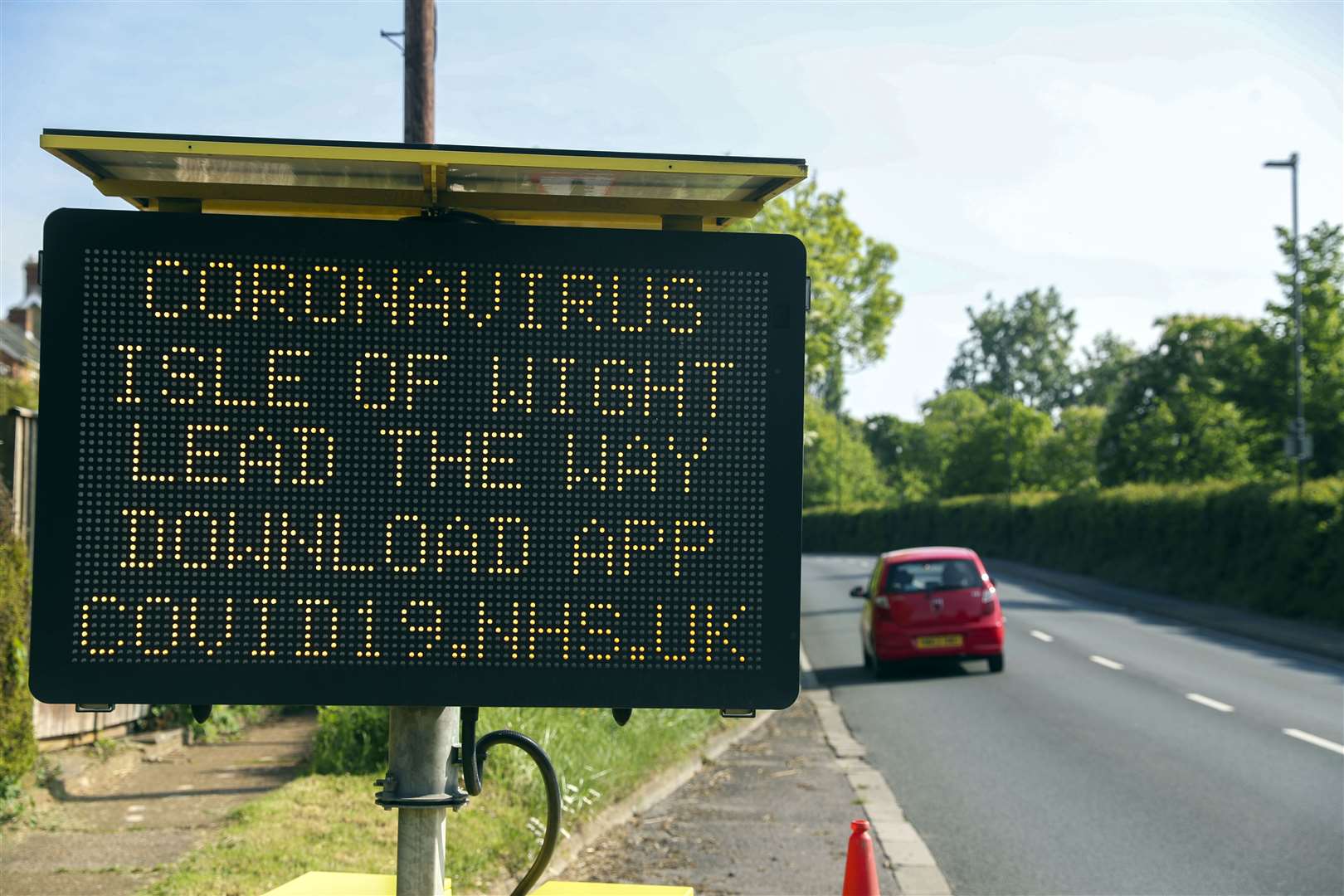 A signs tells people in the Isle of Wight to download the NHS app (Steve Parsons/PA)