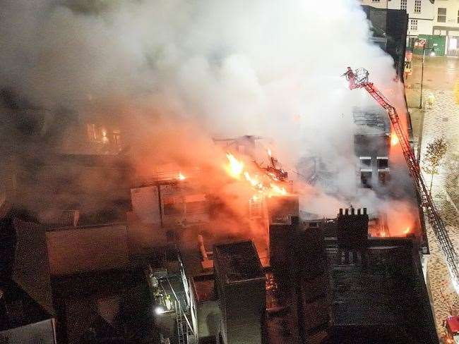 Firefighters tackle a huge blaze at the former Debenhams department store in Guildhall Street, Canterbury city centre. Picture: UKNIP