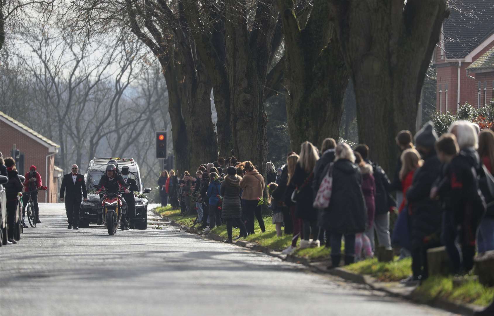 Hundreds of people lined the streets to see Olly Stephens’ funeral procession wind past (Steve Parsons/PA)