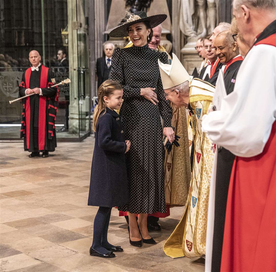 The Duchess of Cambridge laughs as she introduces her daughter Princess Charlotte to the Archbishop of Canterbury Justin Welby (Richard Pohle/The Times/PA)