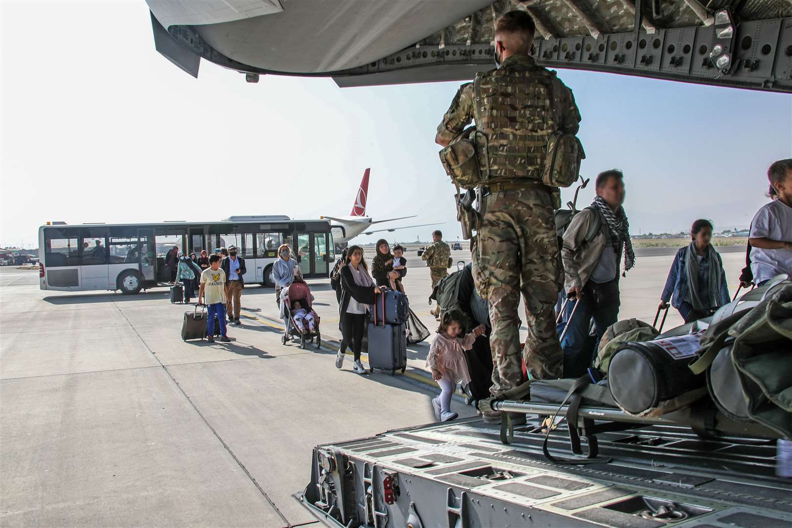 British citizens and dual nationals get on an RAF plane out of Afghanistan (Ministry of Defence/PA)