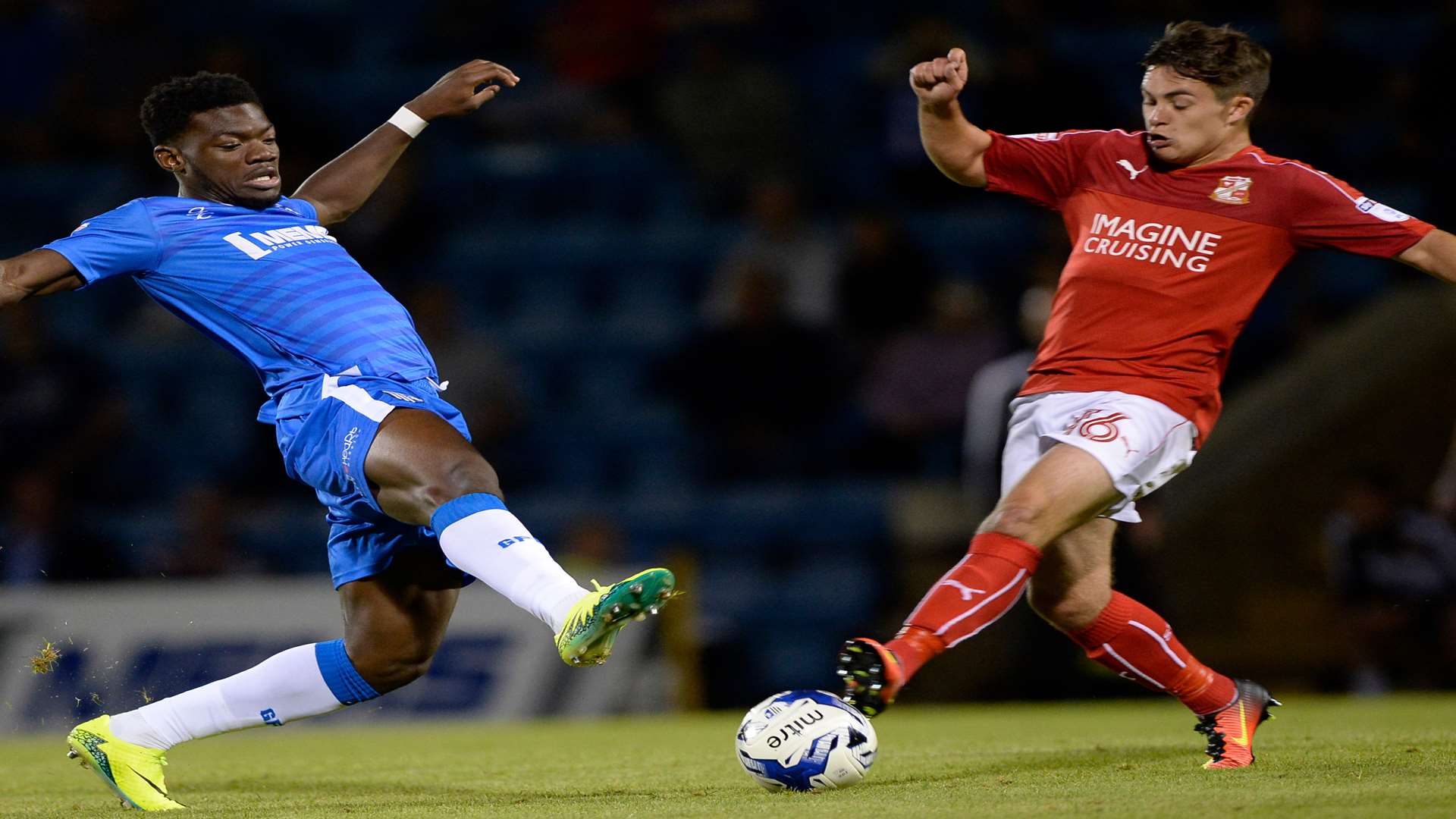 Gillingham's Deji Oshilaja is up against Jordan Stewart. Picture: Ady Kerry