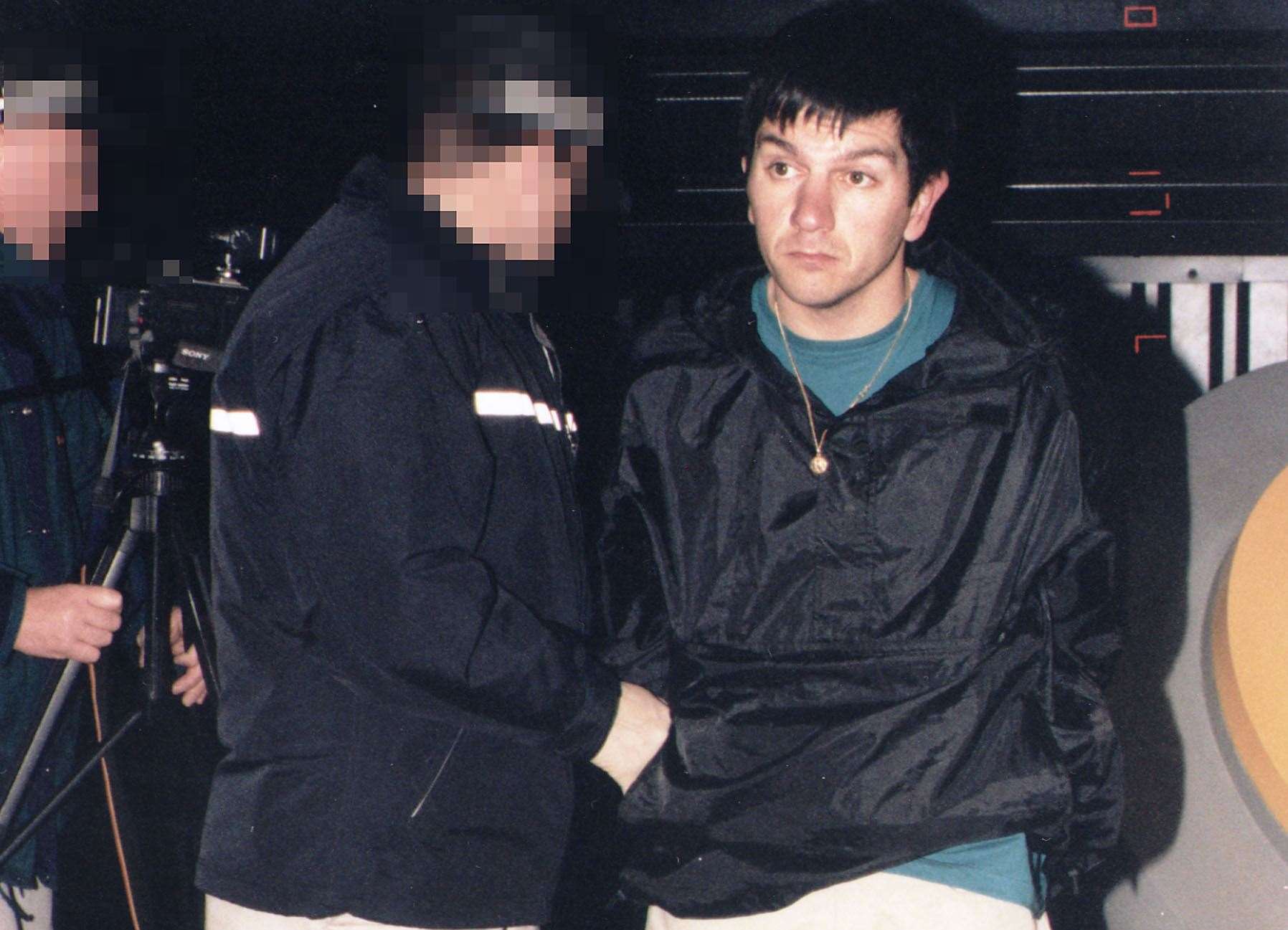 Officers leading away Aldo Ciarrocchi following a failed raid on the Millennium Dome in Novermber 2000. Picture: Metropolitan Police