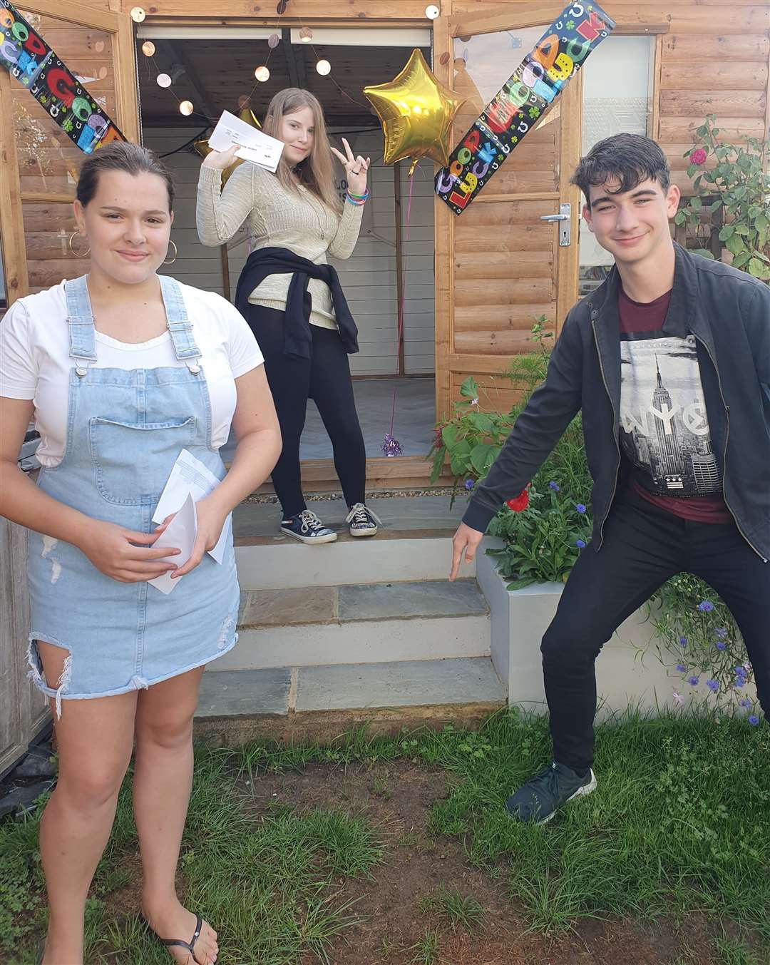 Sheppey home-taught pupils Amelia Tindall, 15, (left), James Wilde,16, (right) and Aiah Smith, 16, (back). Picture: Pip Rothwell