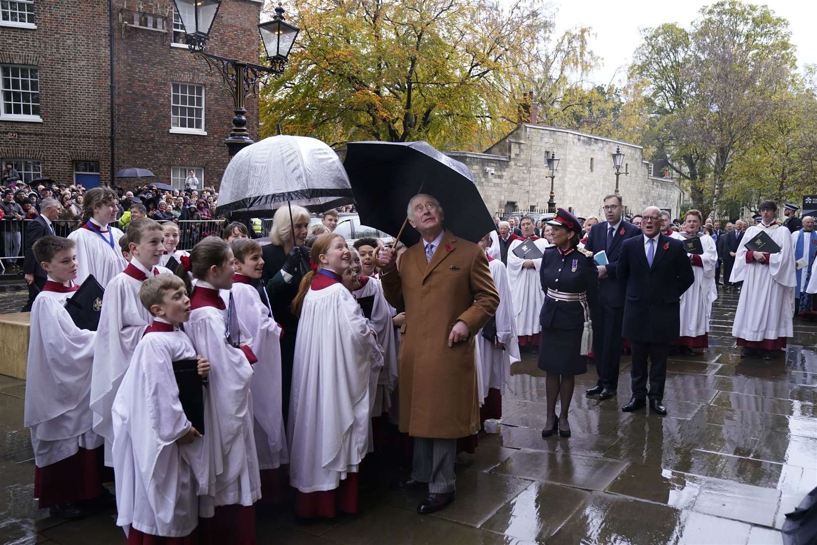 Charles and Camilla look up at the statue (Danny Lawson/PA)