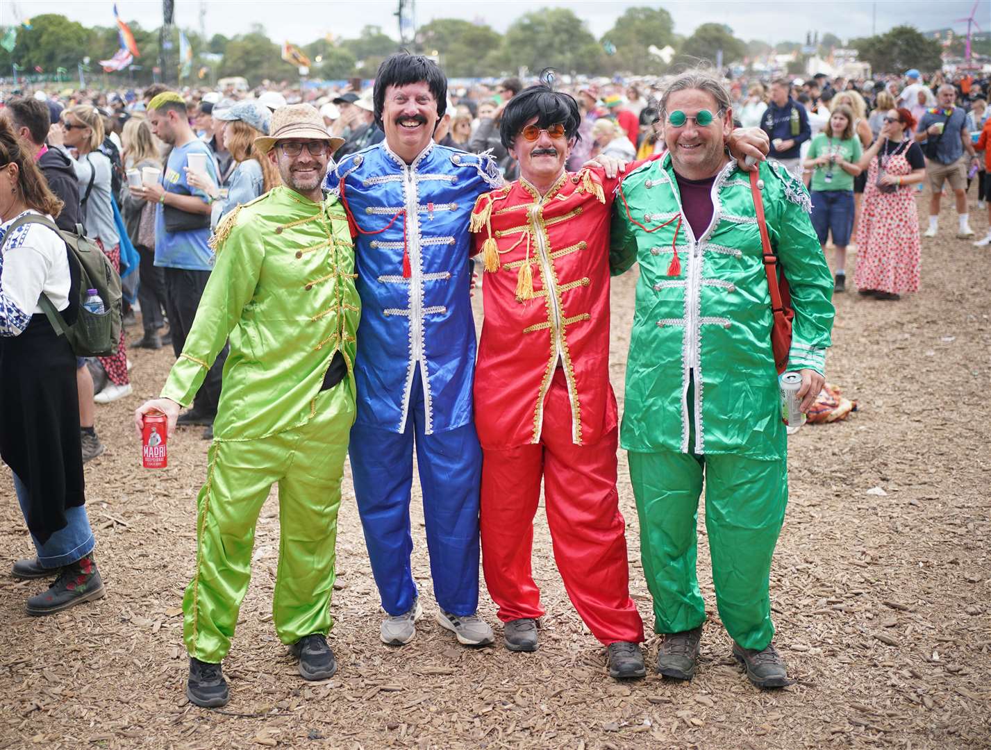 Glastonbury revellers dressed as the Beatles (Yui Mok/PA)