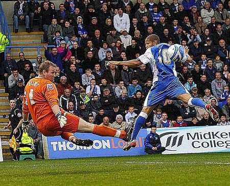 Addicks keeper Rob Elliott denies Simeon Jackson. Picture: Barry Goodwin