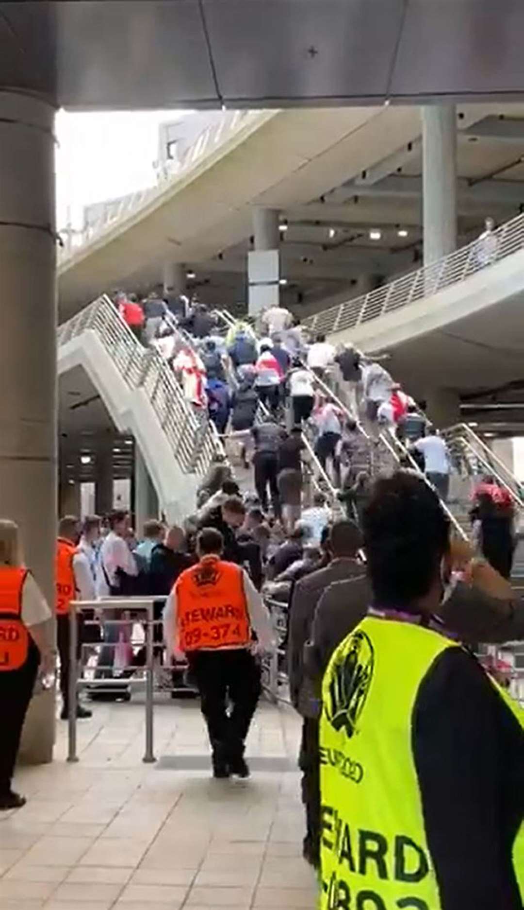 Fans ran up the steps of Wembley as they tried to force their way into the stadium for the final (Michelle Owen/ITV Football/PA)