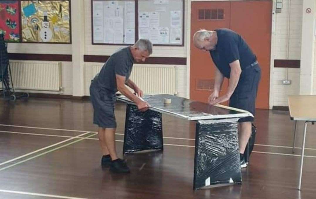 Before the mess: wrapping up the tables is a must to avoid custard everywhere! Picture: Geoff Cooke