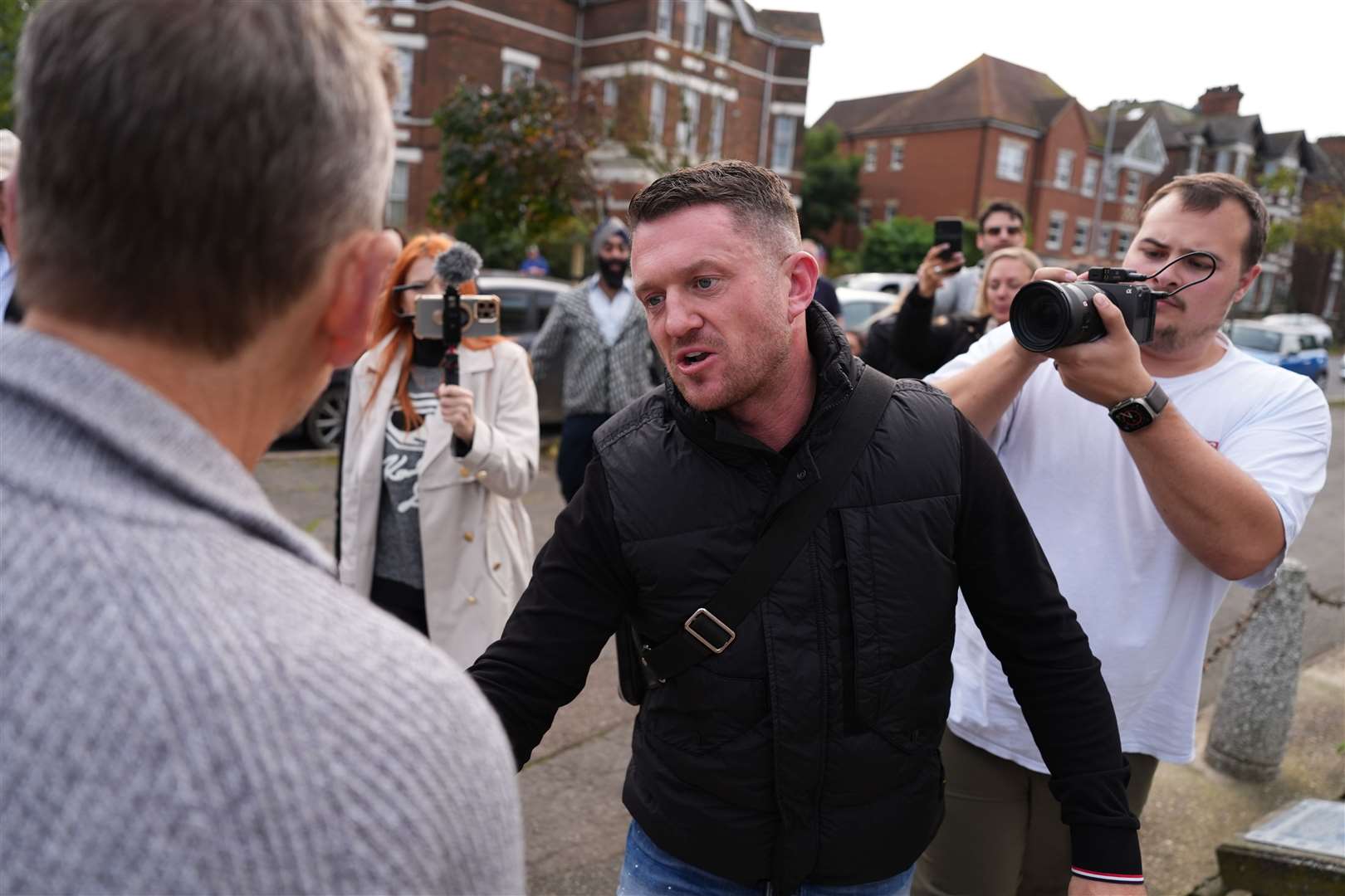 Political activist Tommy Robinson outside Folkestone Police Station on Friday (Jordan Pettitt/PA)