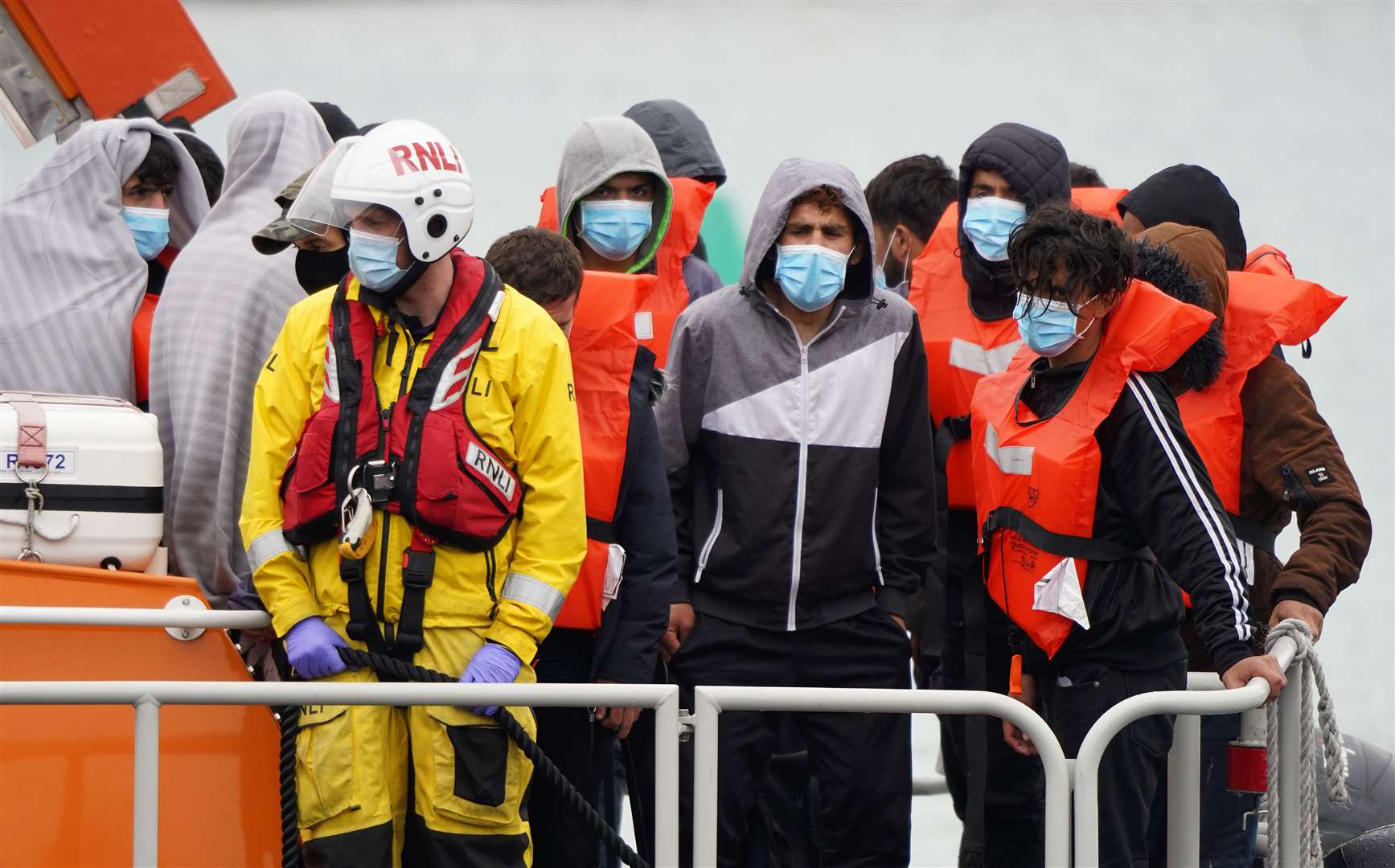 A group of people thought to be migrants are brought in to Dover (Gareth Fuller/PA)