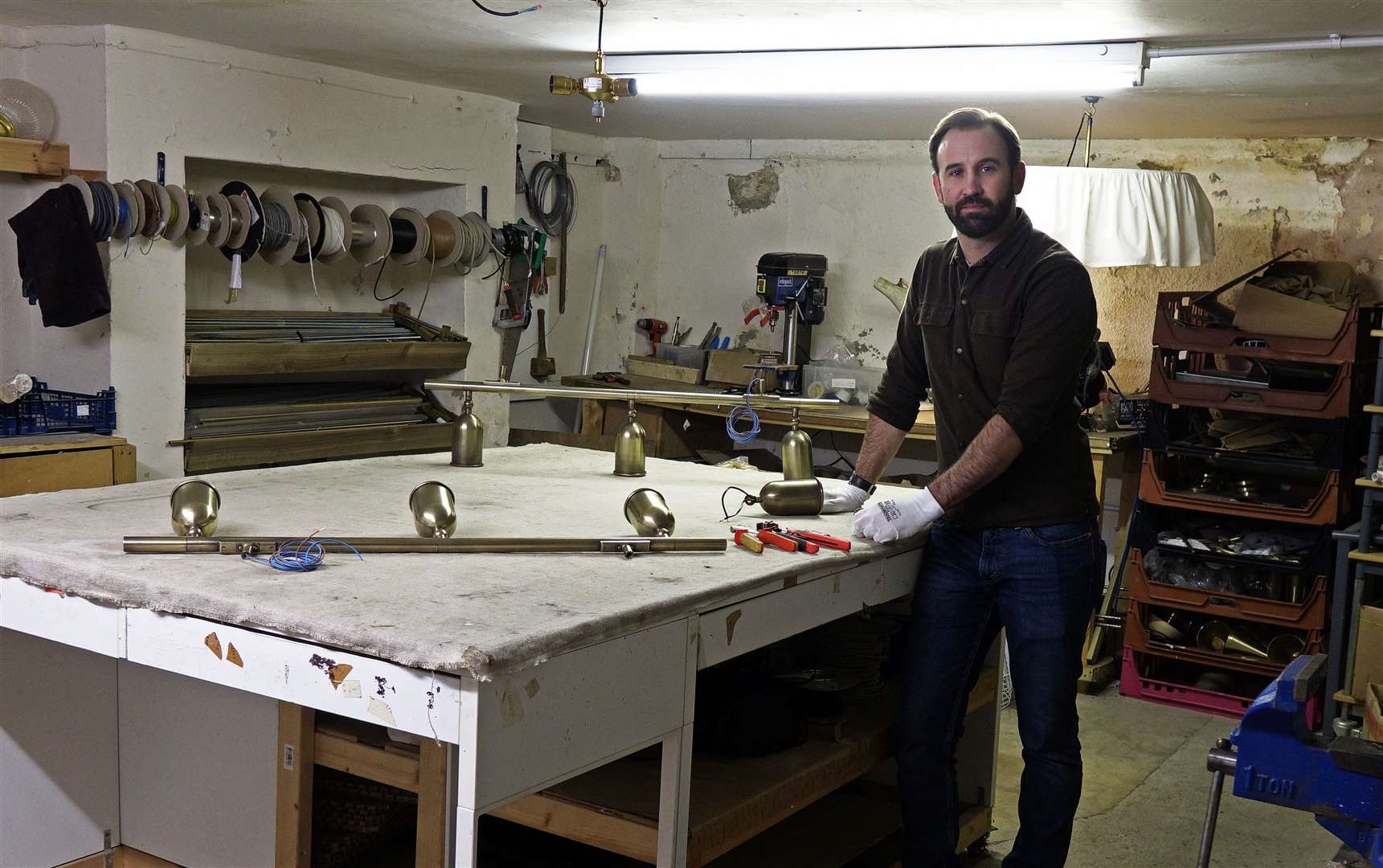 Daniel Fosbery and his staff discovered the plaque to John Baird when they moved into 26 Guildhall Street two years ago. Daniel is pictured in the basement where Baird worked. Picture: Fosbery Studio