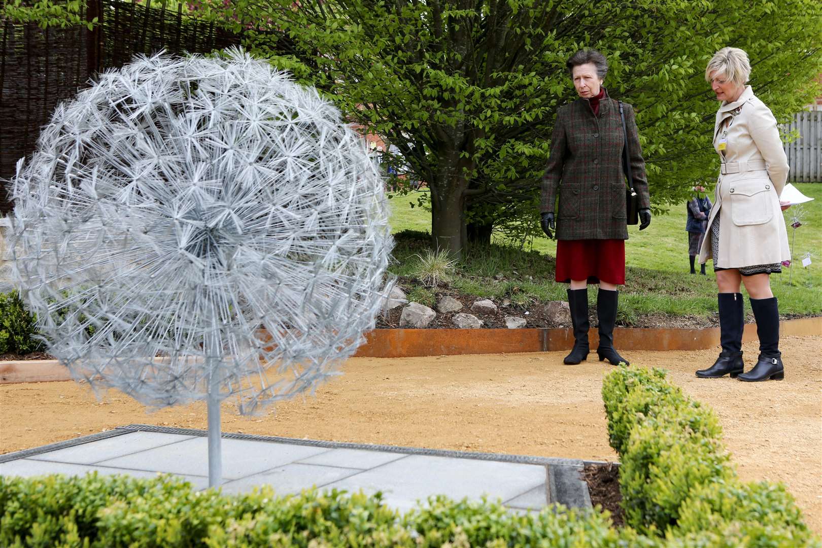 The Princess Royal views wire dandelions, which commemorate those who have died with coronavirus, at the Cheltenham General Hospital (Gloucestershire Hospitals NHS Foundation Trust/PA)