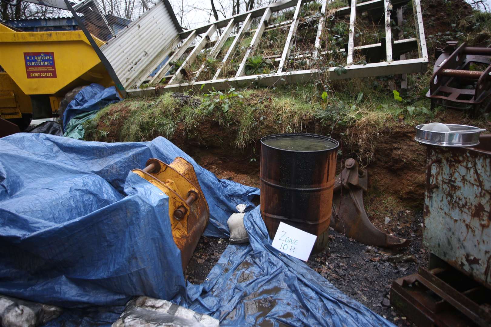 Charred remains of Mr O’Leary’s intestine were recovered from a rusty oil drum in a yard next to Jones’s home (Dyfed-Powys Police/PA)