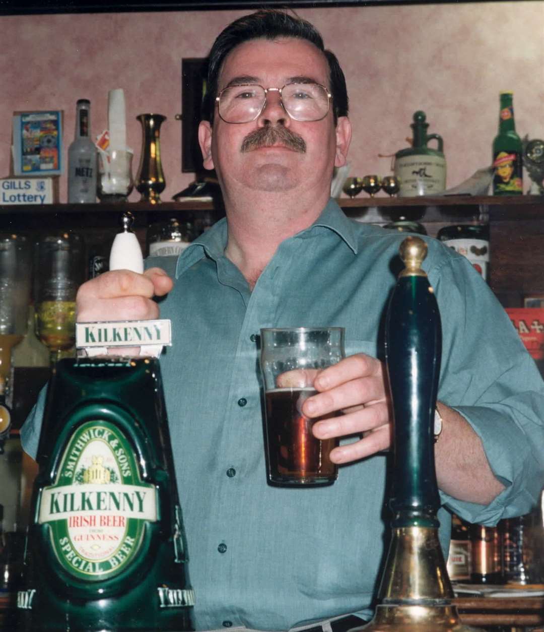 Tony McCarthy serving the drinks in The Britannia, Gillingham, in 1997