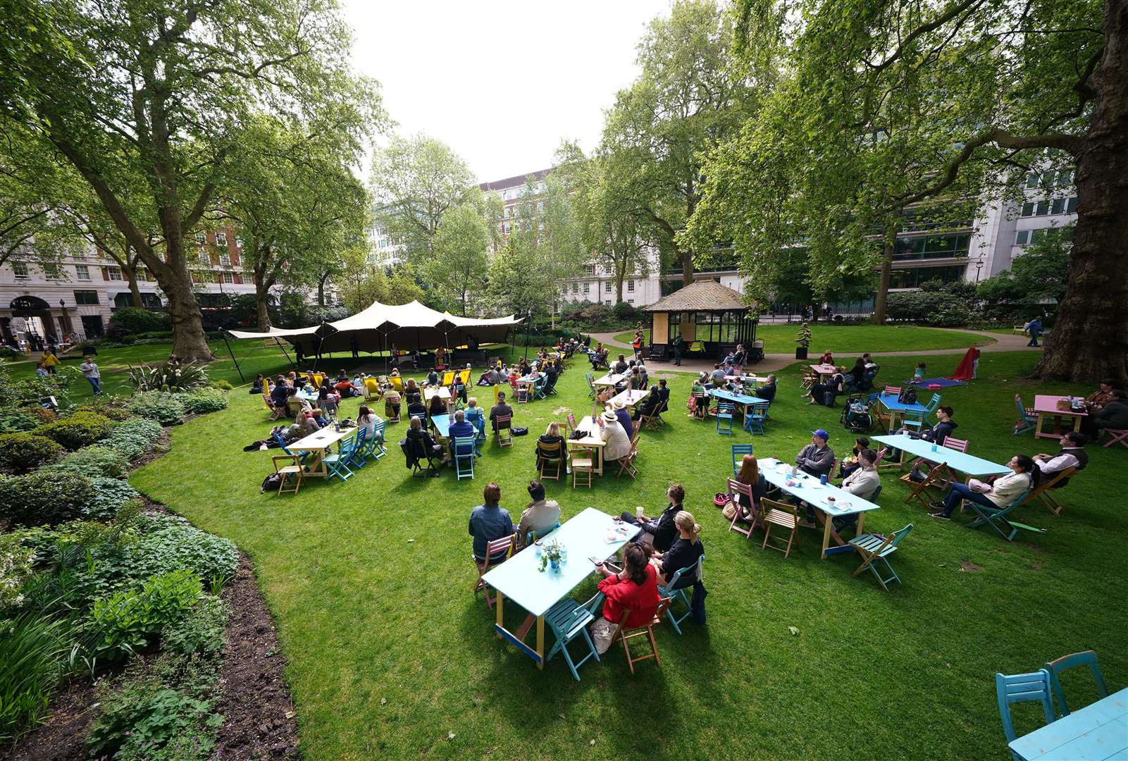 Londoners enjoyed a performance by percussion group Beaten Track, during a free ticketed outdoor picnic concert in Portman Square Garden (Yui Mok/PA)