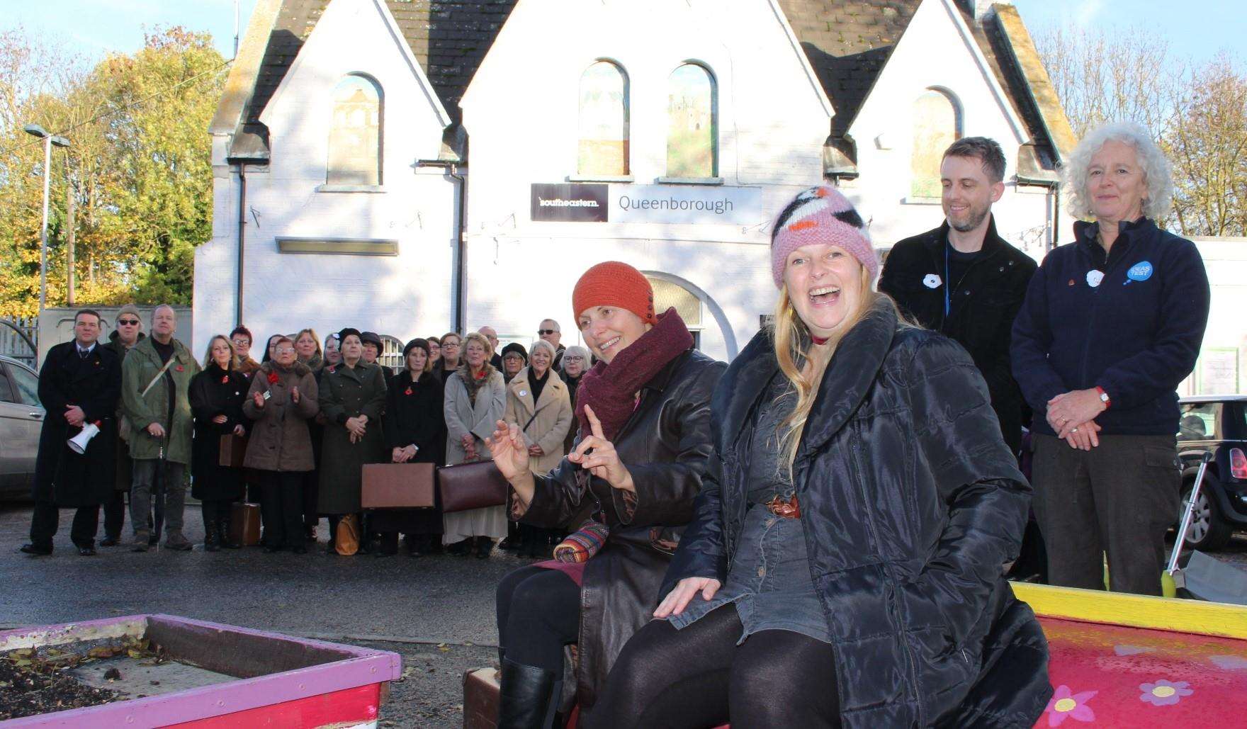 Tania Holland-Williams, left, and Emily Peasgood with Kevin Grist and Lucy Medhurst and the 55-plus choir at Queenborough train station on Sunday performing Never Again. Picture: John Nurden (5337045)